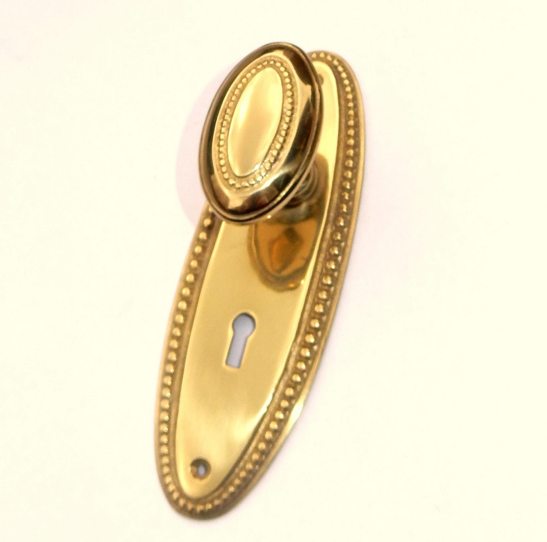 Vintage Polished Cast Brass Beaded Oval Door Knob Set with